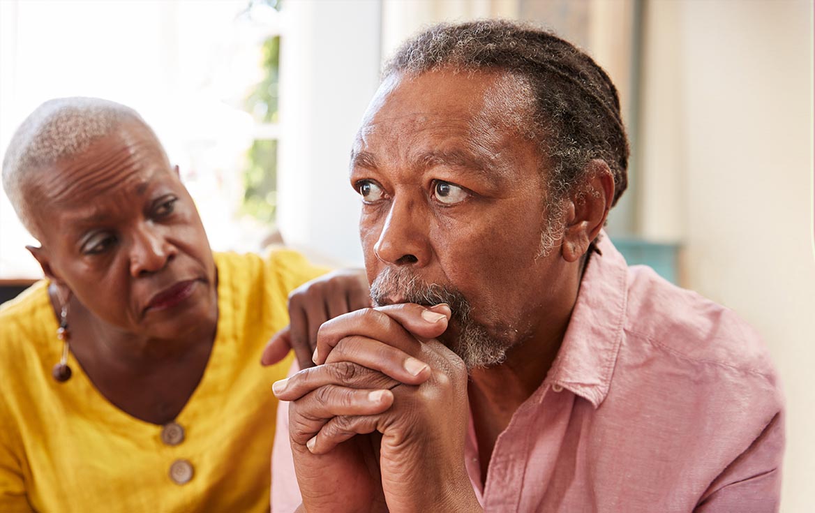 black older couple looking worried